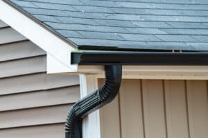 Roof gutter with downspout