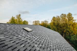 New repaired roof covered with shingles