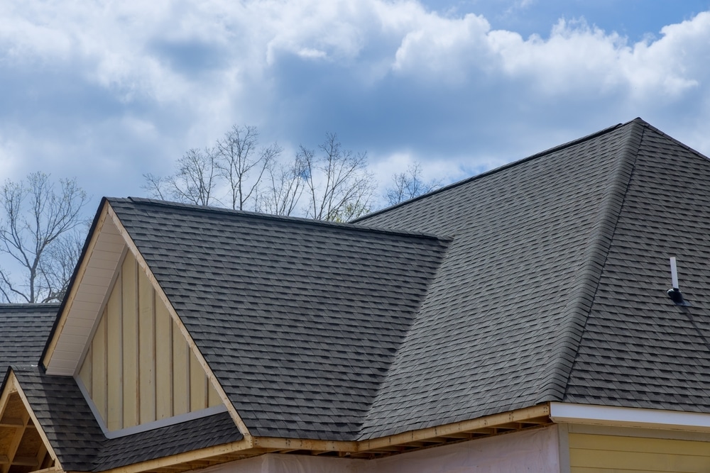 Asphalt shingles roofing construction for new house in covered corner roof shingles