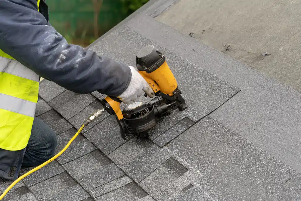 Roof masters expertly repairing a leaky roof after rain
