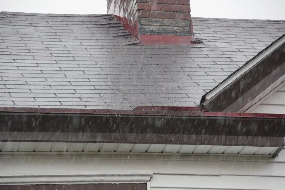 Heavy rain with house shingle roof 