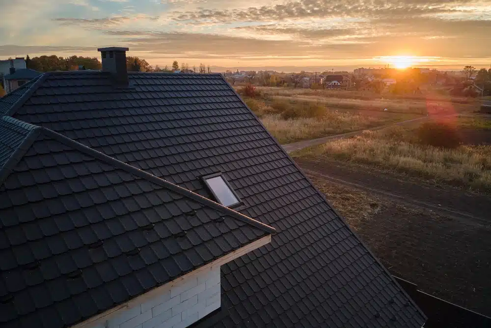 Closeup of house rooftop covered with ceramic shingles