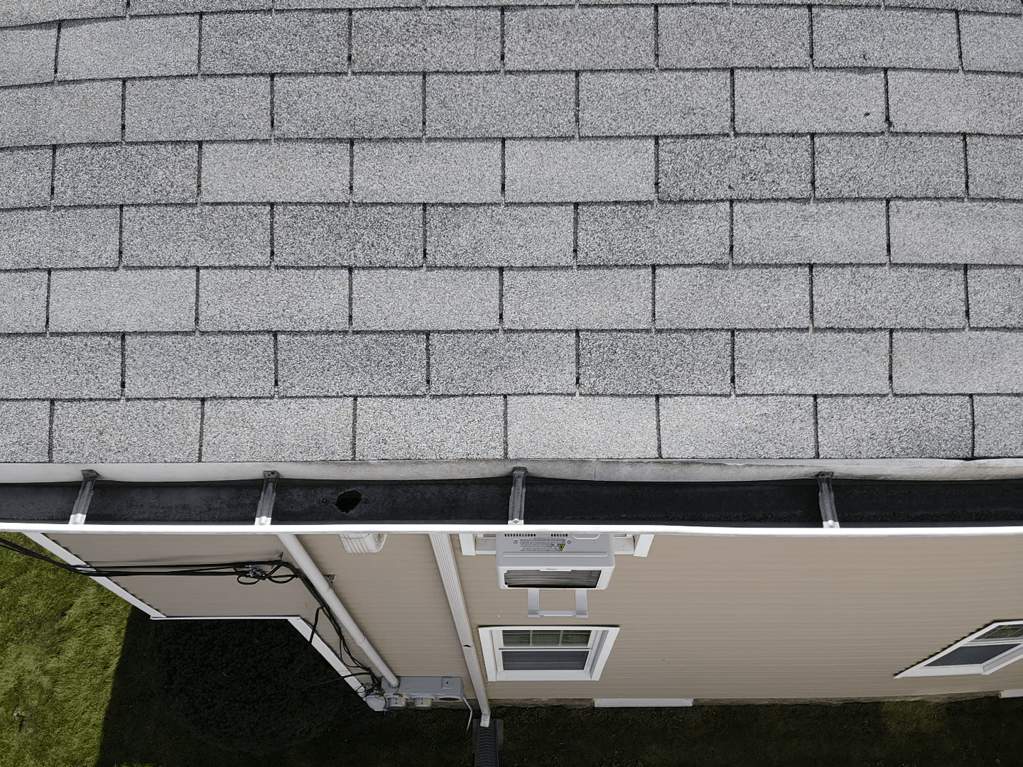 Newly repaired roof with cleaned gutters