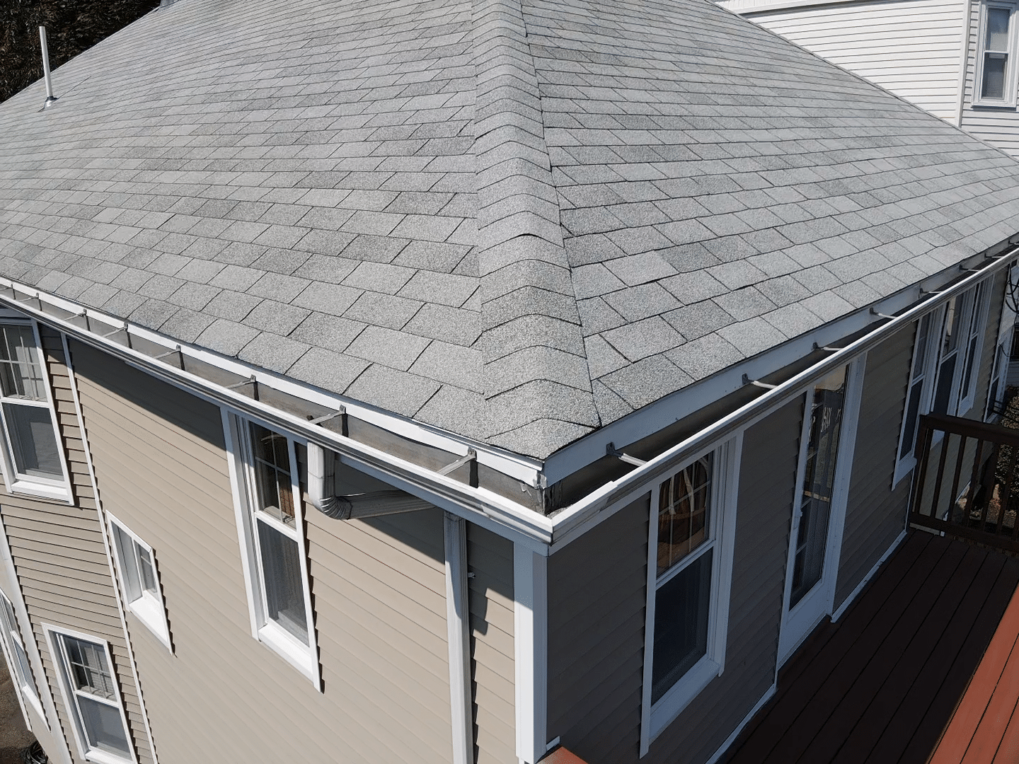 Newly repaired roof with cleaned gutters