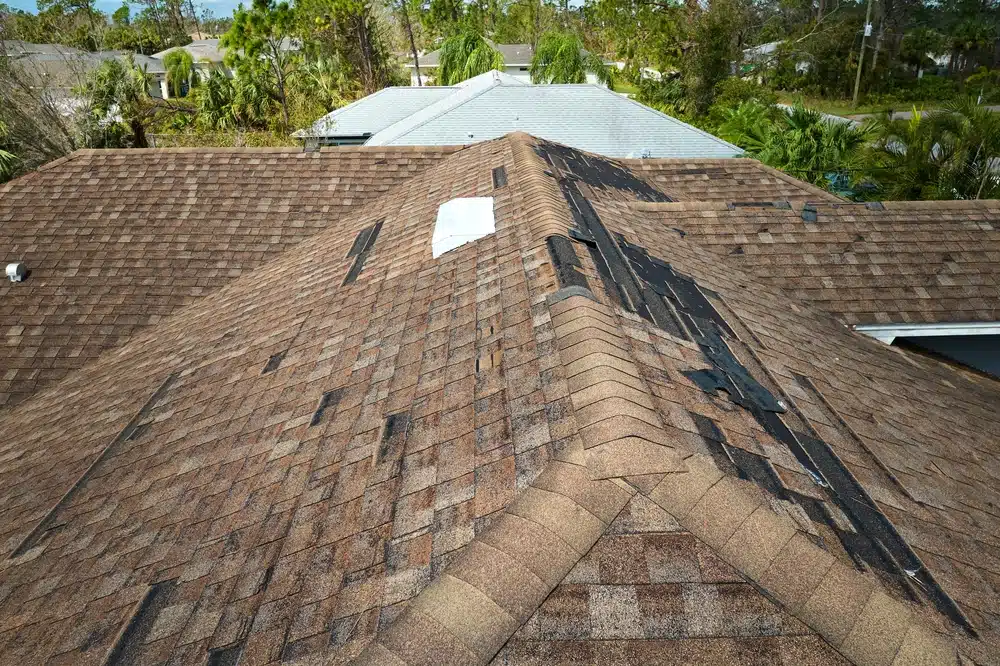 Roof leak from missing shingles after a hurricane
