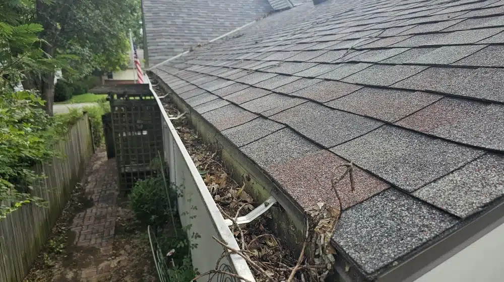 Roof leak caused by overflowing, clogged gutters
