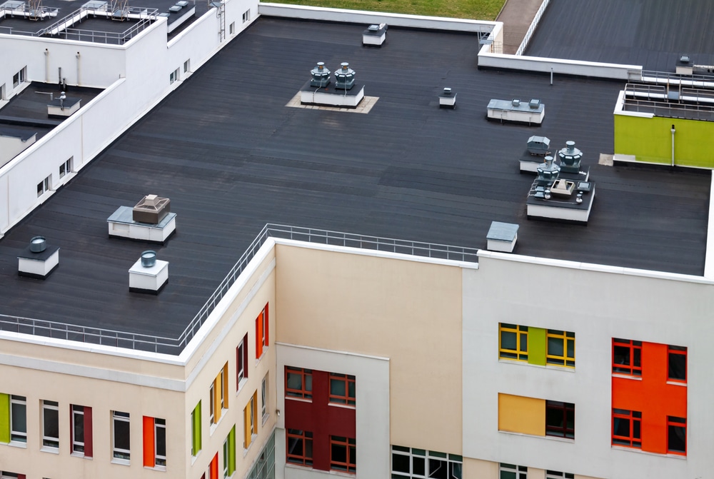 Top view dark flat roof with air conditioners 