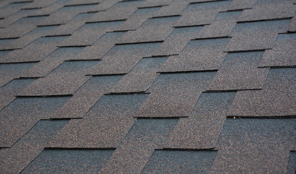 Brown, copper asphalt shingle roofing texture.
