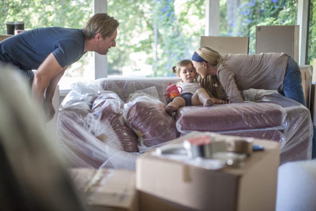 Family with Their Child Indoors Making Sure She is Safe