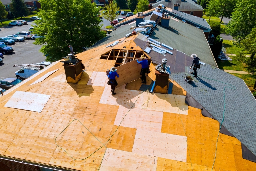 Replace old asphalt bitumen shingles on house roof in order to repair roof.
