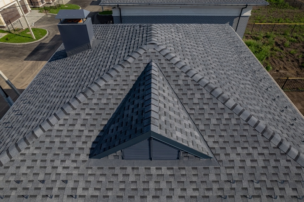 Close-up view showcasing the detailed texture of asphalt roofing shingles, highlighting their durable and weather-resistant design.
