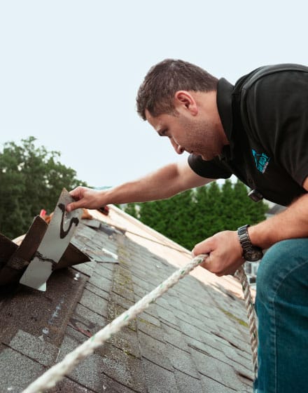 Professional roofer conducting a free roof inspection in Boston, MA, ensuring quality and reliable roofing solutions