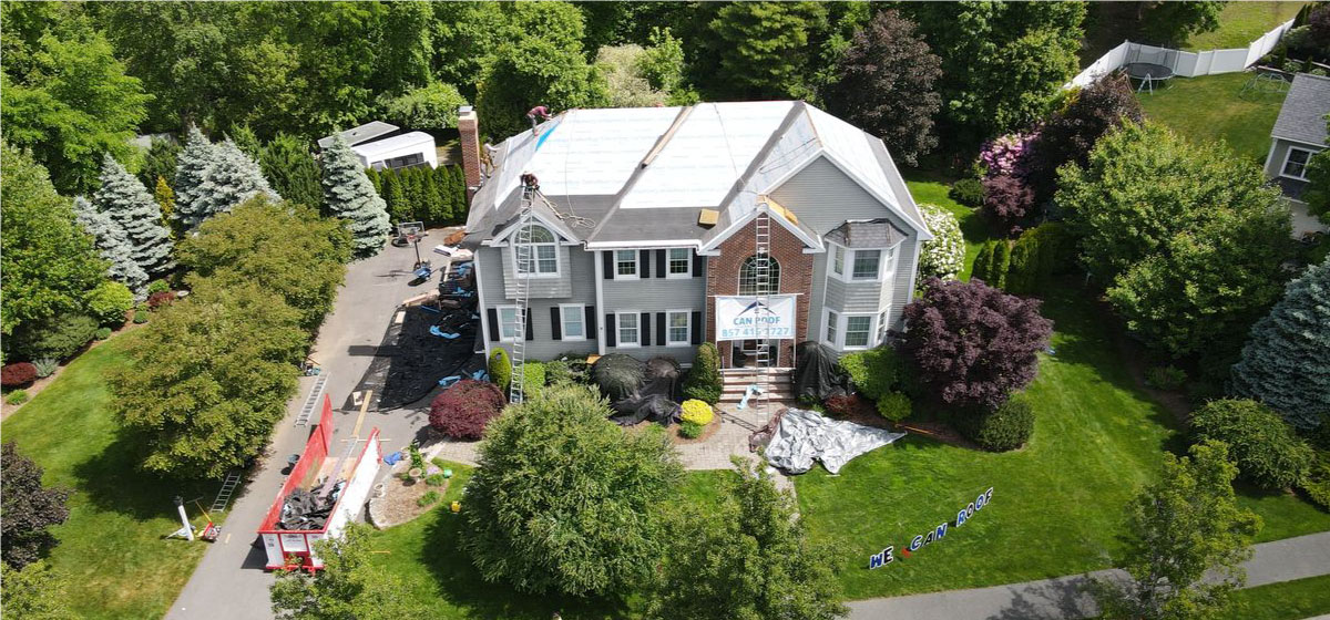 Aerial view of a roof replacement project by CAN Roof Construction, providing expert roofing solutions in Boston MA