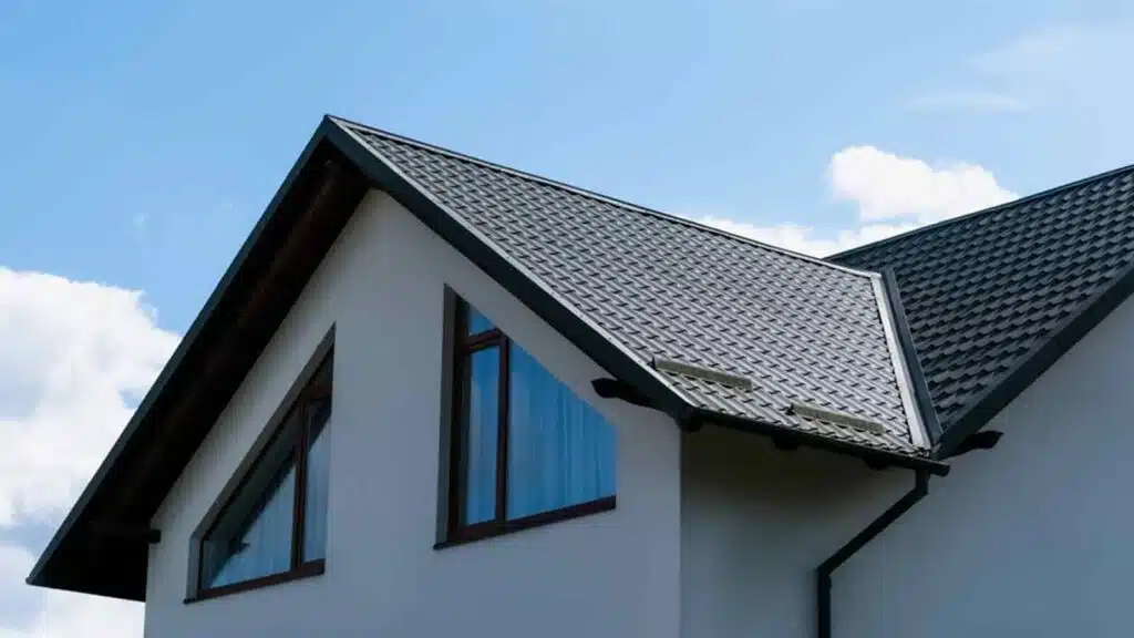 The roof of a newly built private house on a sunny day, residential roof repair, roof replacement in Boston