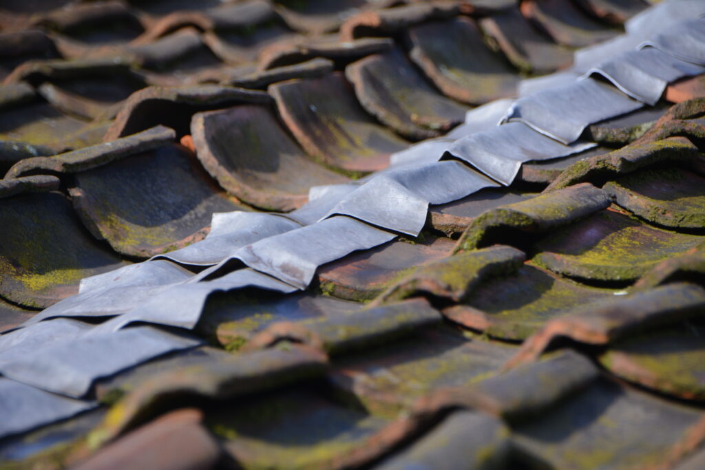 Metal Impact-resistant roofing material installed to protect against hail and storm damage