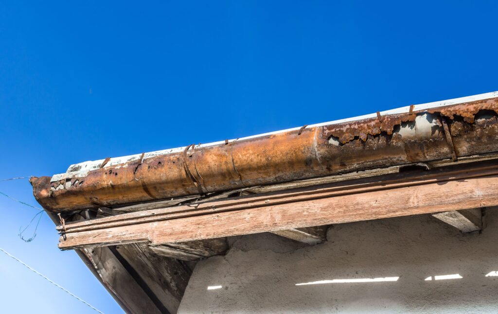 Damaged roof with gutter needs repair to prevent roof leak