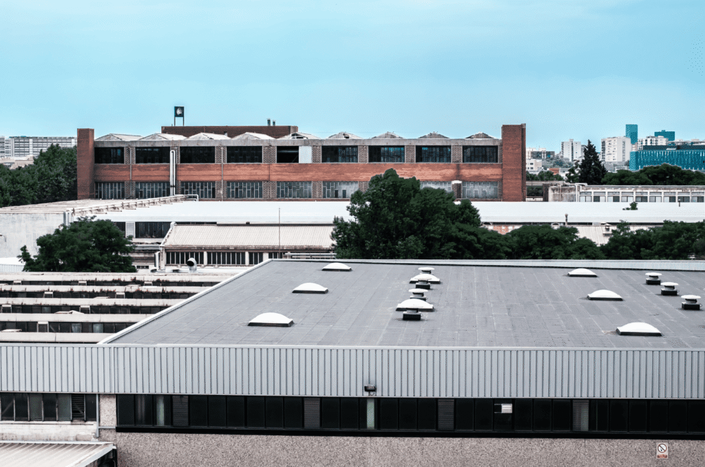 Commercial flat roof roofing system on city building highlighting professional commercial roof service and durability