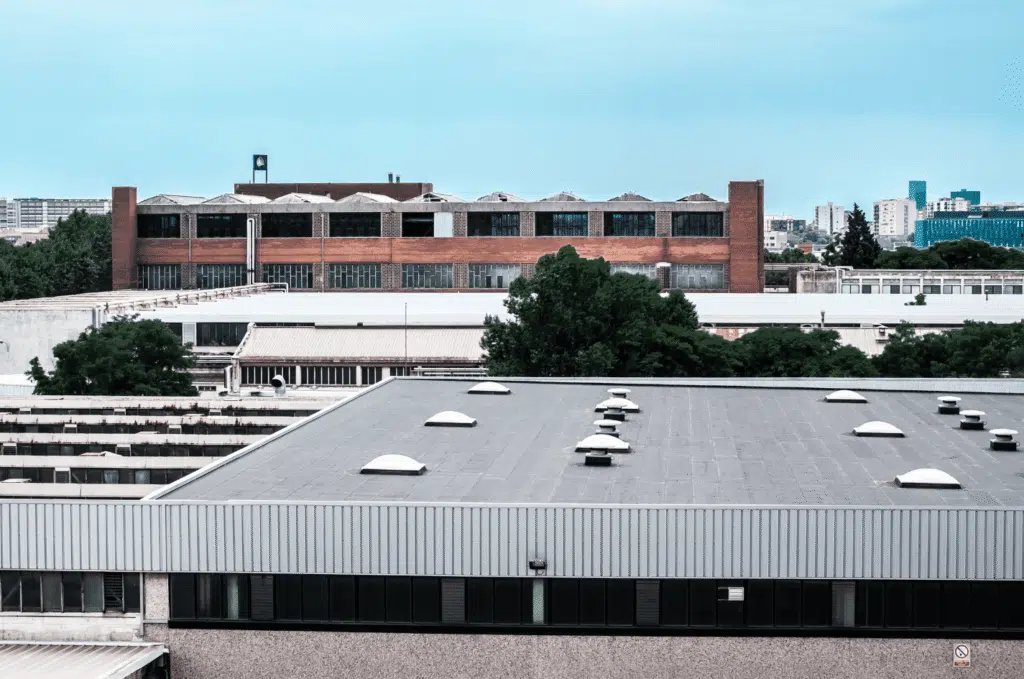 Commercial flat roof roofing system on city building highlighting professional commercial roof service and durability