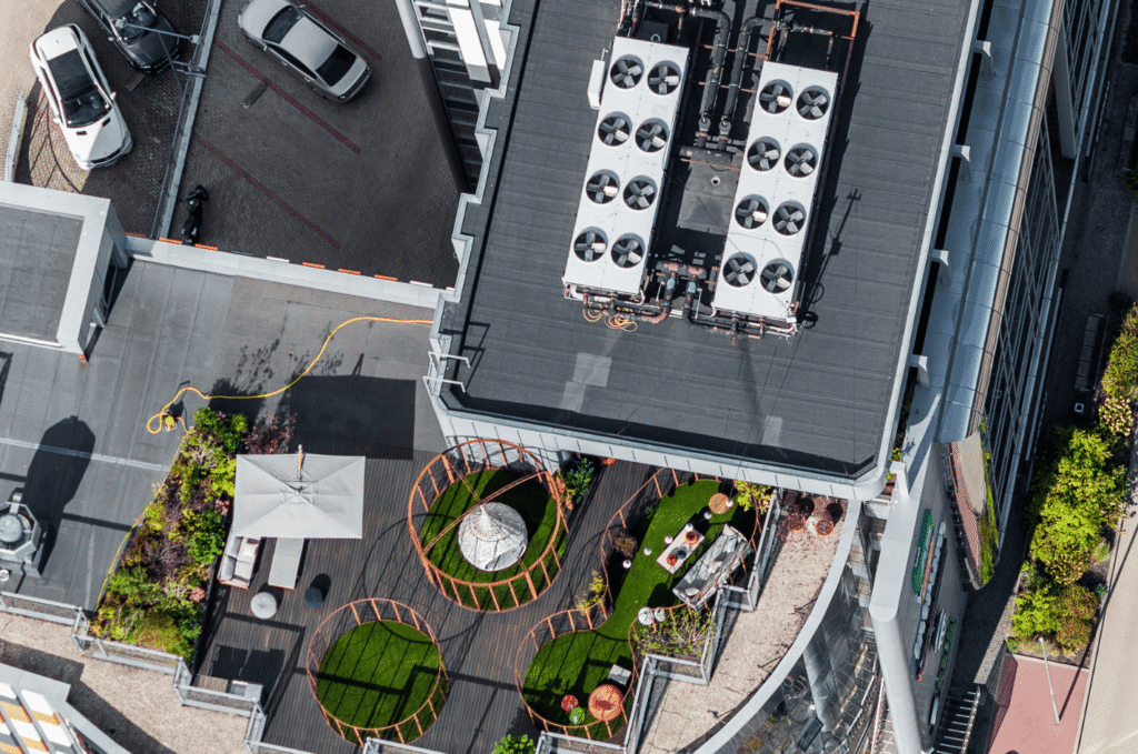 Commercial roof aerial view showing HVAC units, flat roofing system, and organized rooftop equipment layout