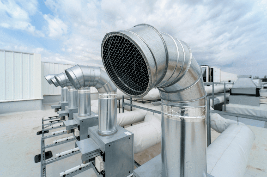 Restaurant roofing system with grease vent and commercial exhaust ducting designed for heat and airflow control