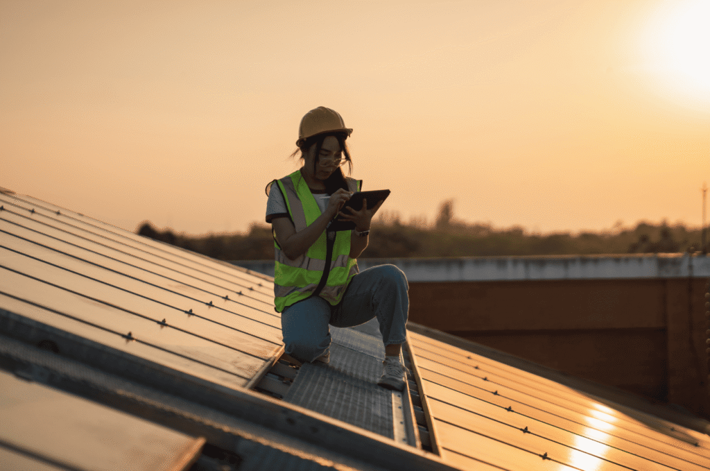 Roof inspector reviewing roofing at sunset during a roof estimate for new roof installation planning and material assessment