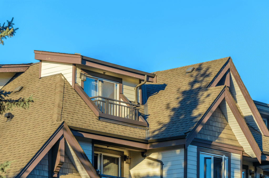 Finished shingle home exterior after new roof installation, showcasing clean lines and results of roof estimate plan