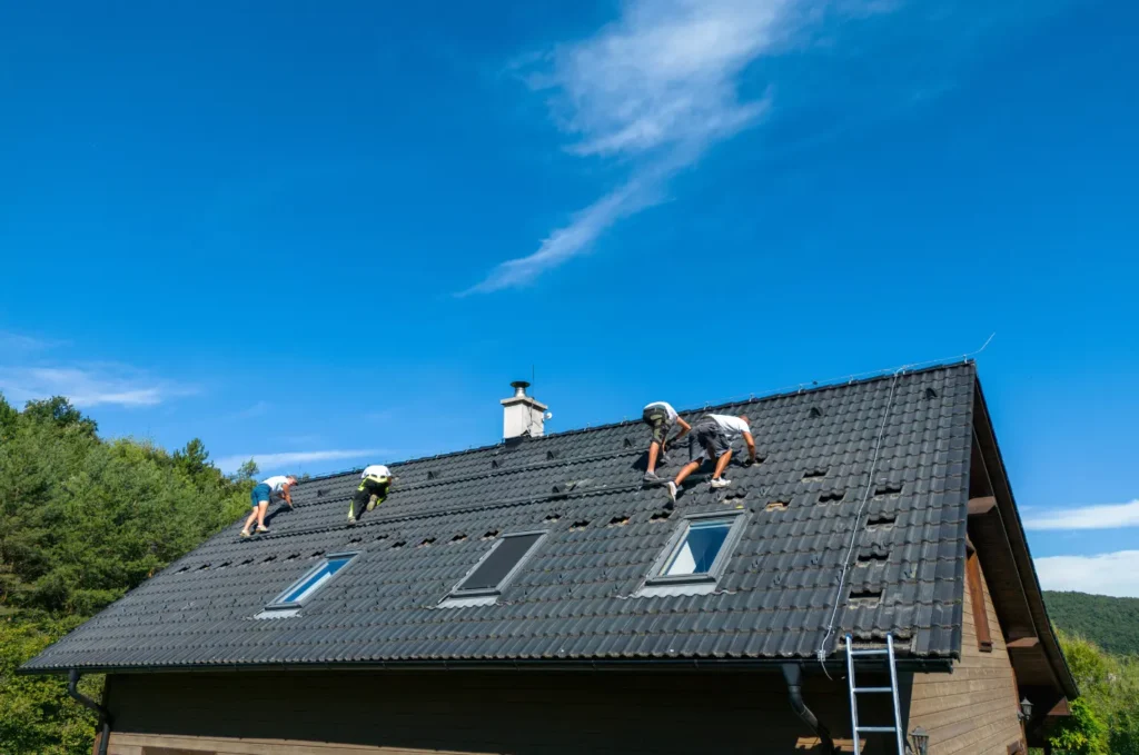 Roof replacement completed on a modern home with durable asphalt shingles, clean ridge lines, and proper ventilation installed