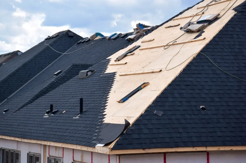 Roof replacement in progress with old shingles removed and new underlayment prepared for strong, weather-resistant installation
