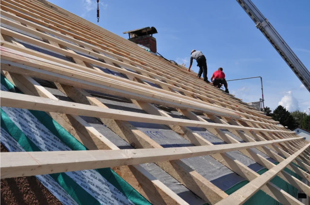 New roof installation underway with wooden battens and structural preparation ensuring proper support and long-term durability