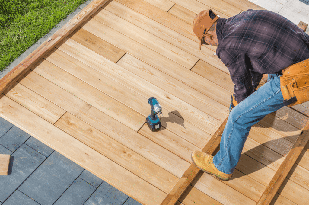 a constructor installing new deck with wood type of deck