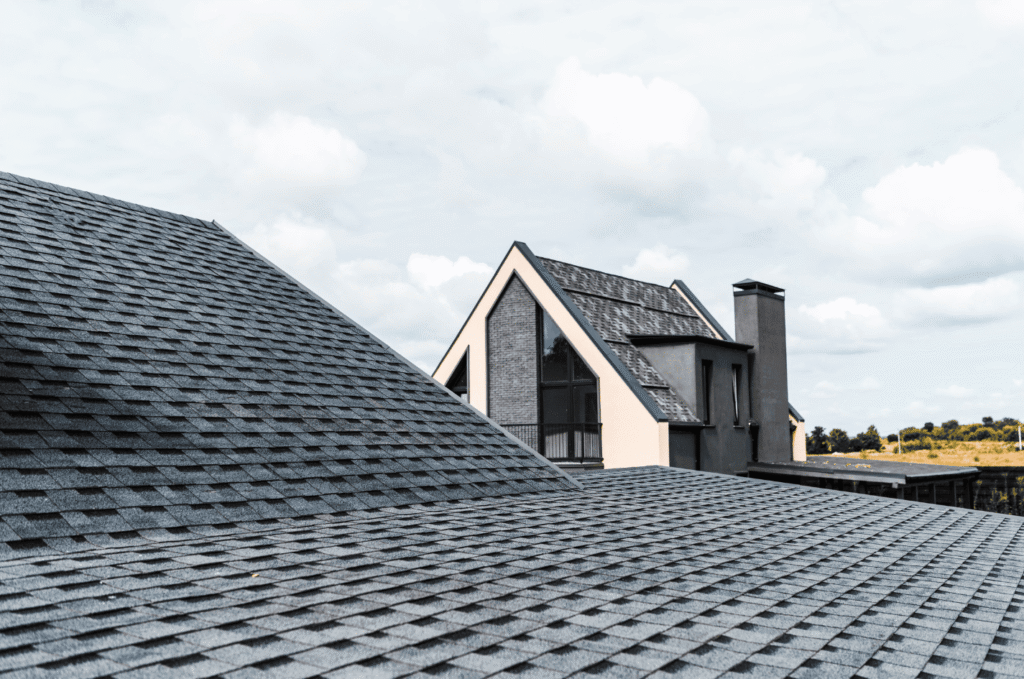 Modern home with asphalt shingle roofing materials designed to protect against wind, rain, and everyday wear