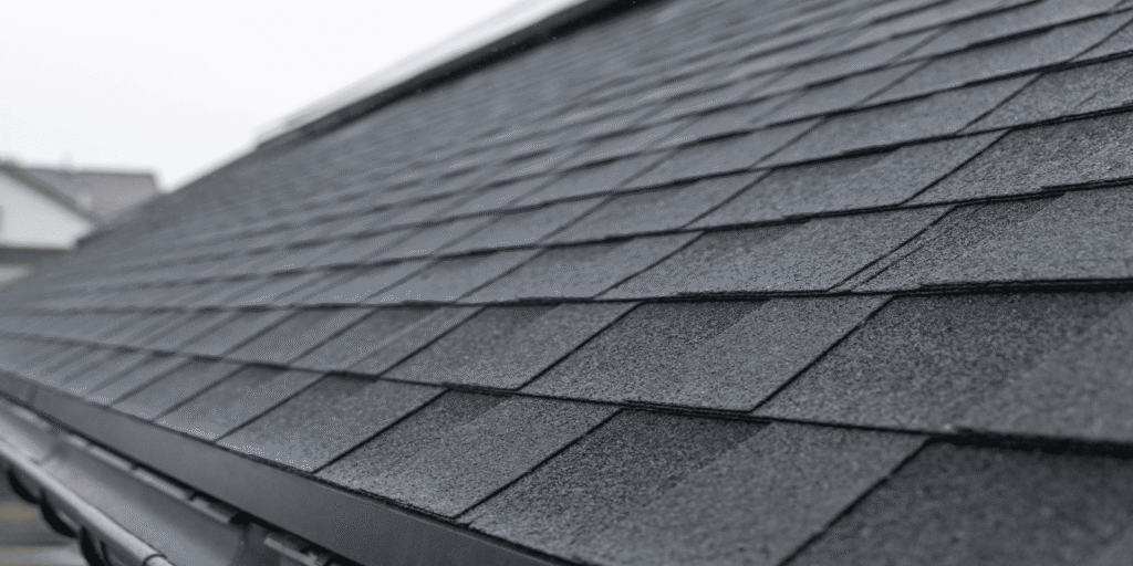 Close view of an asphalt shingle roof showing neat rows of shingles that help keep water out and protect the home