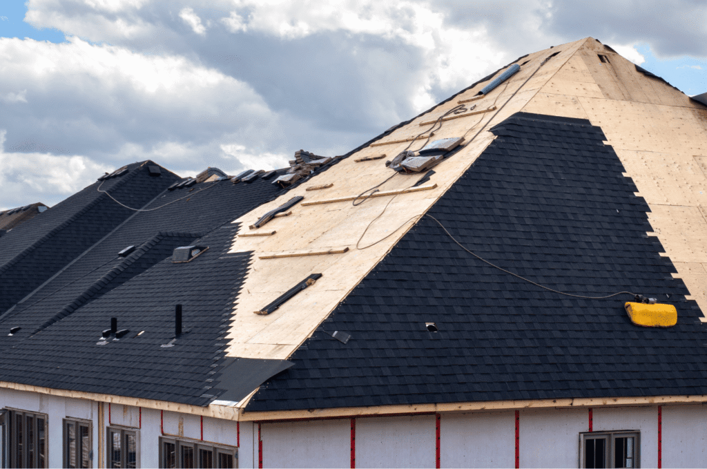 Roof repair in progress with asphalt shingles and exposed decking showing why temporary roof leak fixes may be needed