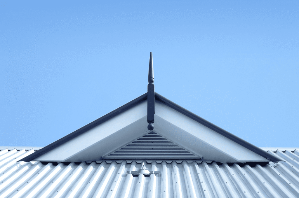 Modern metal roof with a visible gable vent, showing how attic ventilation helps reduce moisture and condensation buildup.