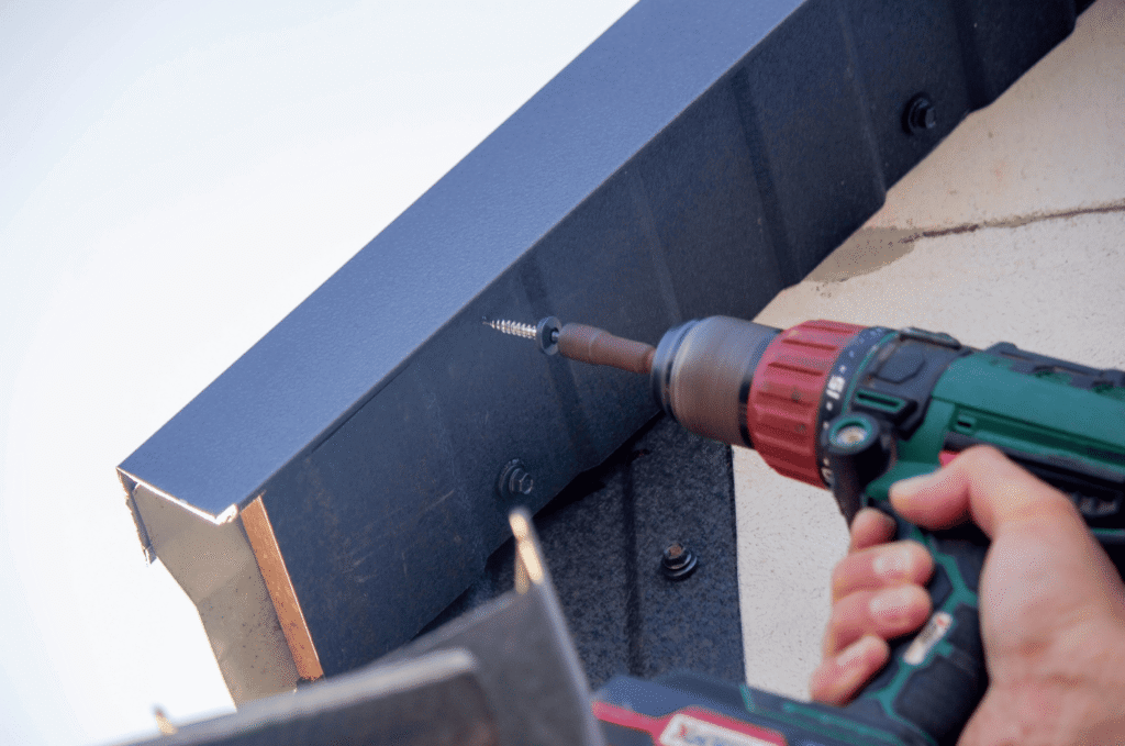 Drip edge flashing and gutter detail along a residential roof edge helping guide rainwater away from fascia and soffit areas