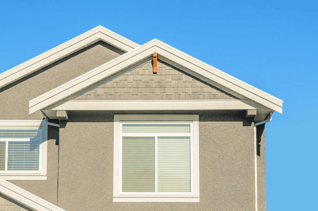White fascia and soffit along a Boston home roof edge, showing areas checked during rotted fascia and soffit inspection work