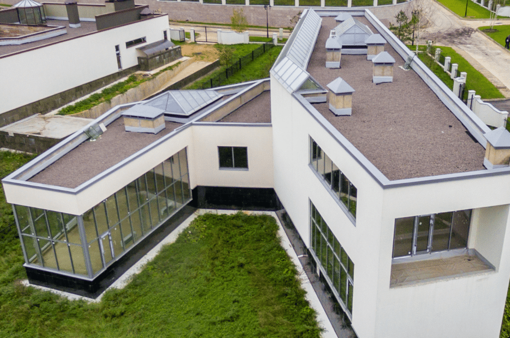 Modern low-slope roof on a residential property showing a clean surface for routine inspection and preventive maintenance.