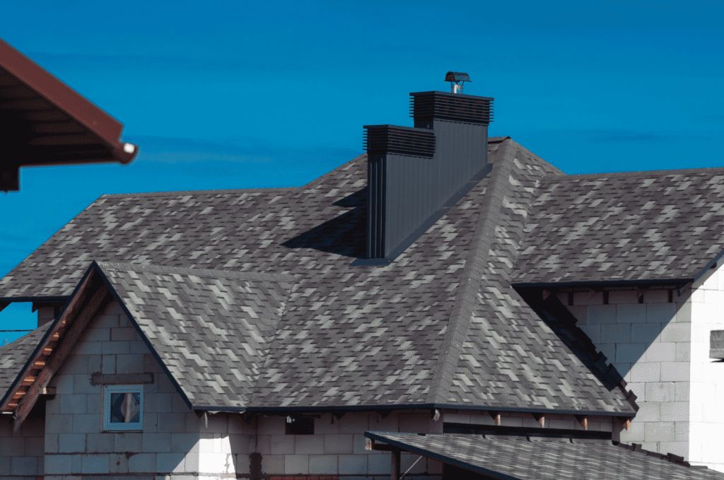 Residential shingle roof under construction showing areas that may require professional inspection and repair in Boston homes