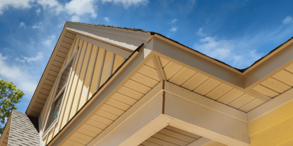 Close-up of a home's soffit and fascia along the roof edge, the boards most at risk of soffit and fascia damage over time