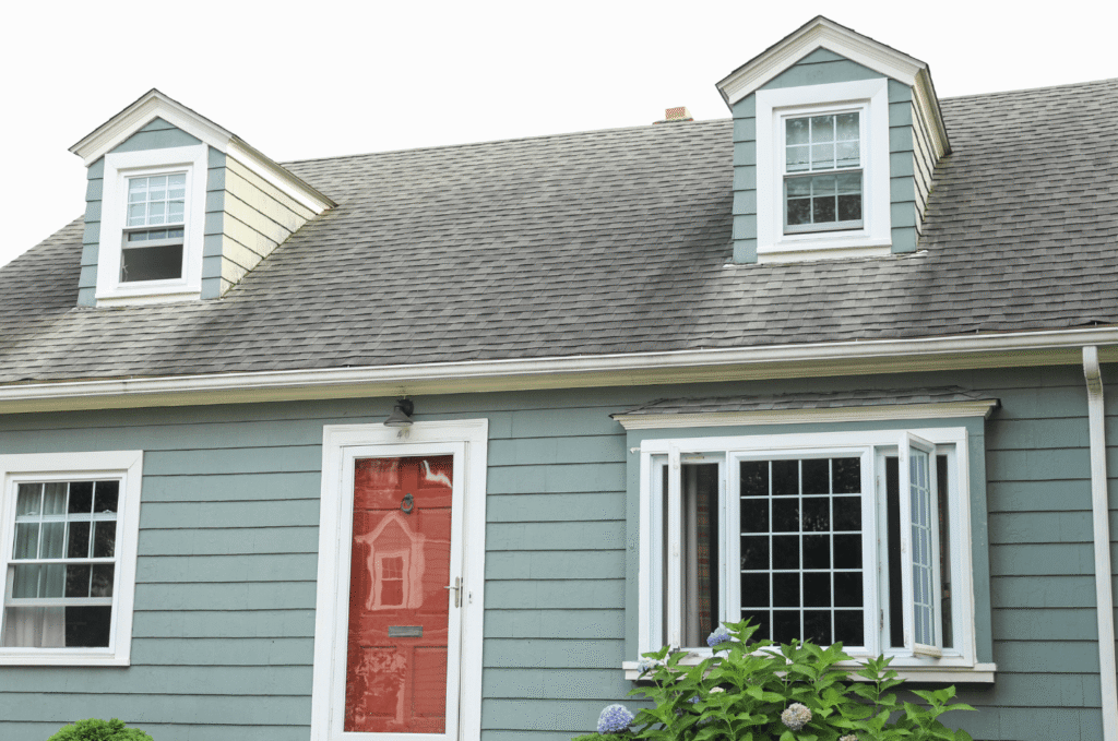 Boston-style home with asphalt shingle roof, ready for inspection to spot summer heat, moisture, and shingle damage early