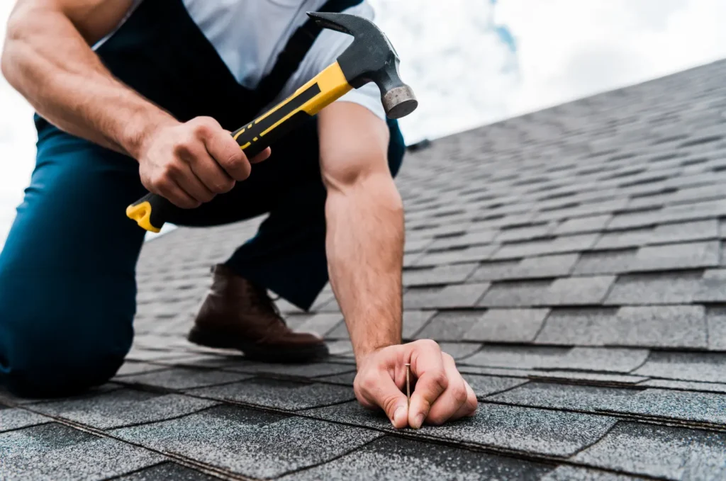 Roof repair finished on a home with damaged shingles replaced for a cleaner roof surface