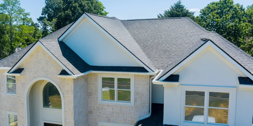 Roofing materials like asphalt shingles covering a residential roof with a clean, even finish