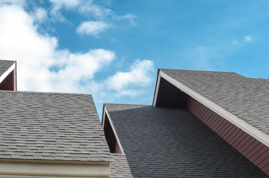Mixed roof with asphalt sections chosen to match different parts of the roof