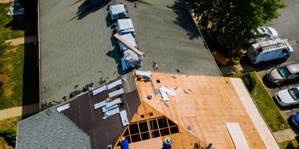Roof rejuvenation applied to asphalt shingles showing visible granule loss and surface wear