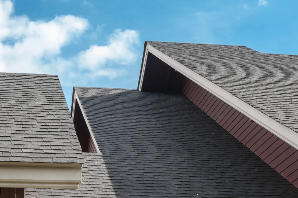 Low slope roof finished with protective roof material designed for a flat surface.