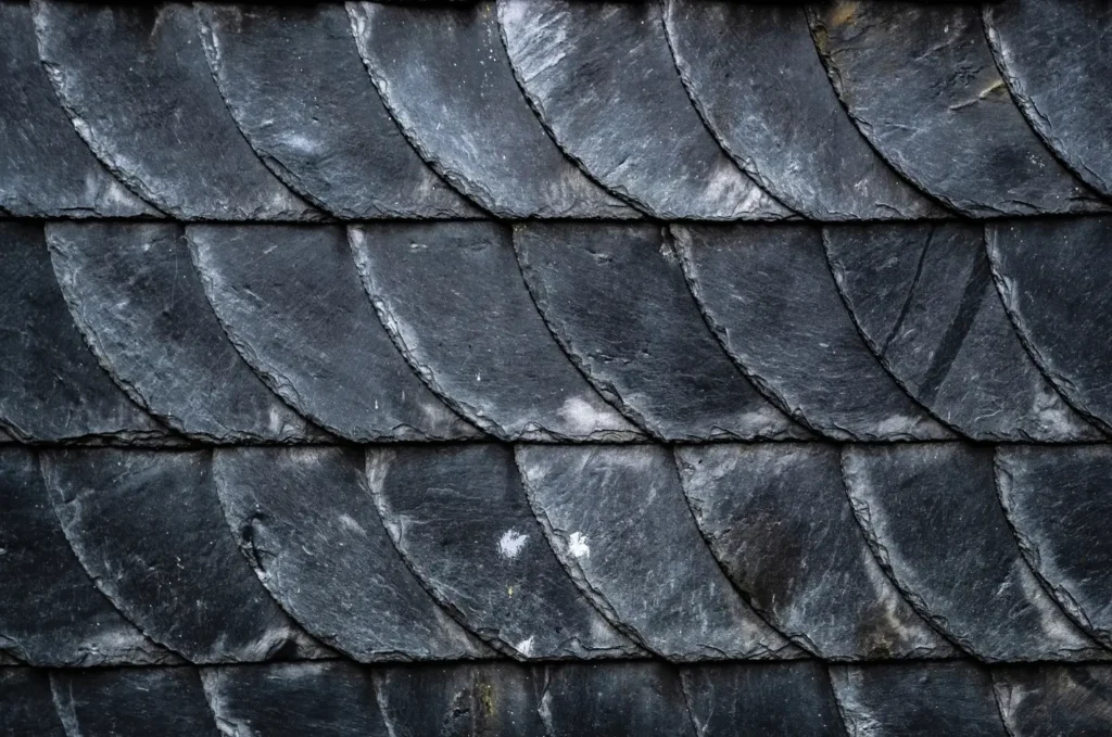 Slate roof on a home featuring durable stone tiles arranged across the pitched surface
