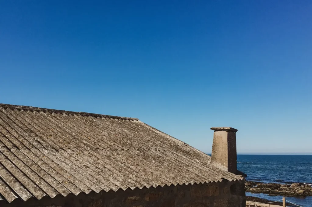 Coastal roof material used on a sloped home roof built for salt air, wind, and changing coastal weather