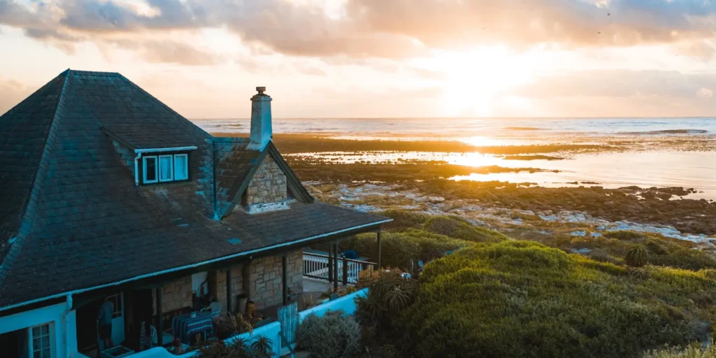 Coastal roof material covering a seaside home with durable shingles designed for exposed weather