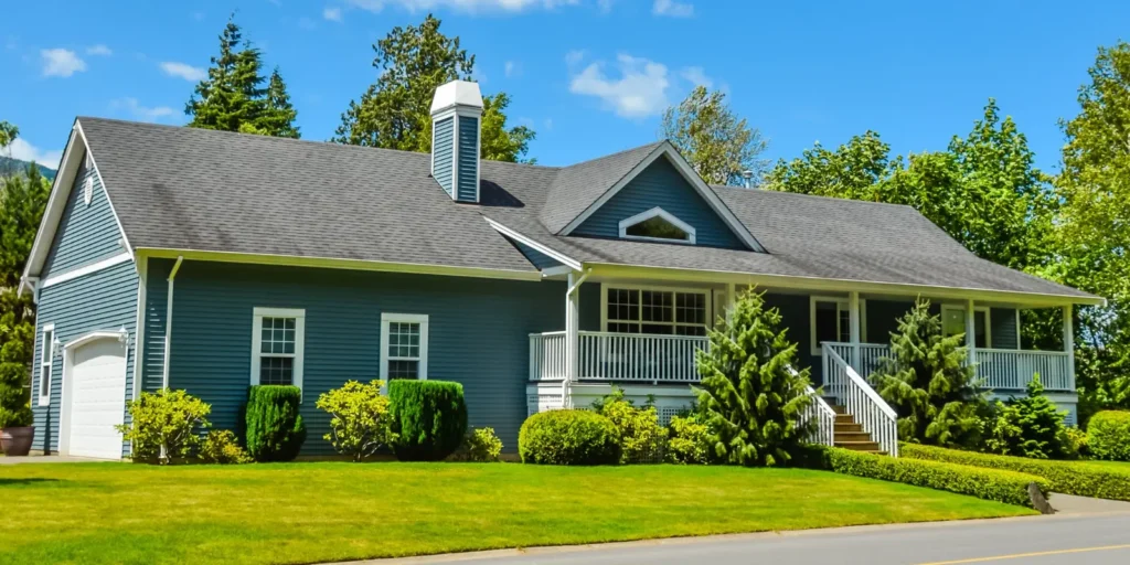 Residential asphalt shingle roof in good condition after a storm, with no visible signs of damage